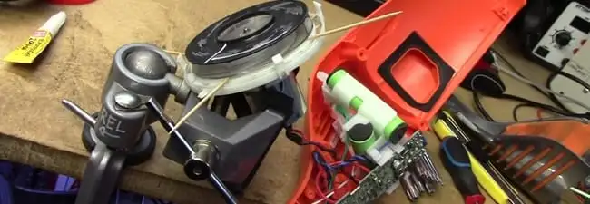 Vacuum cleaner repair parts and tools on a workbench in Orange, CA
